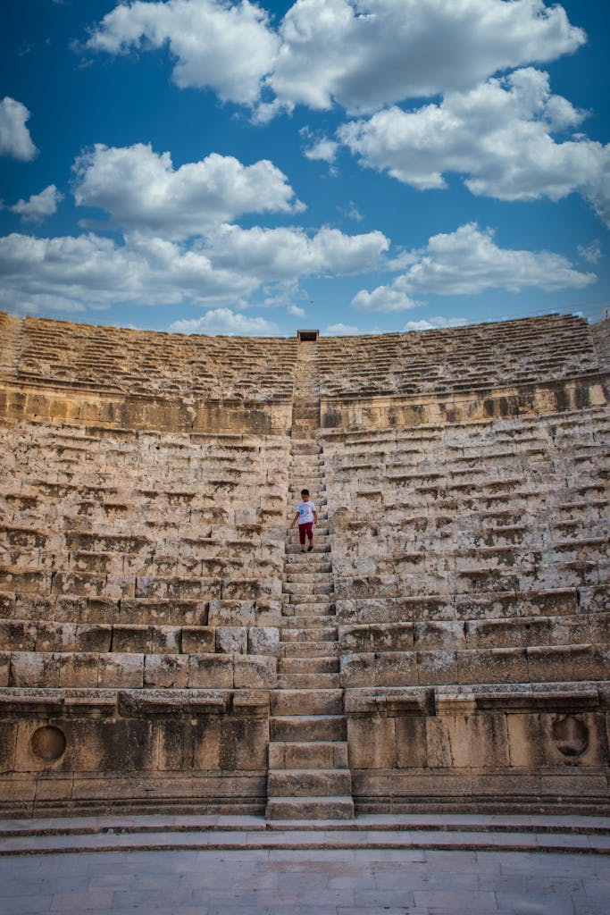 A Boy Standing on the Concrete Stairs