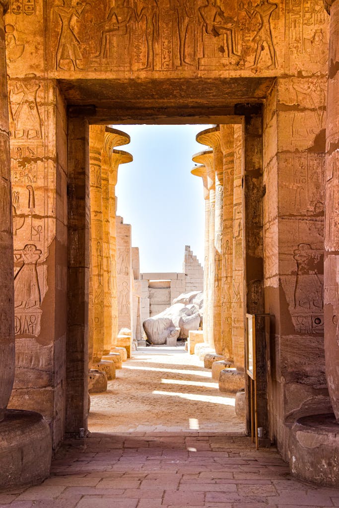 View of hieroglyph-covered columns at Luxor Temple, Egypt, showcasing ancient Egyptian architecture.