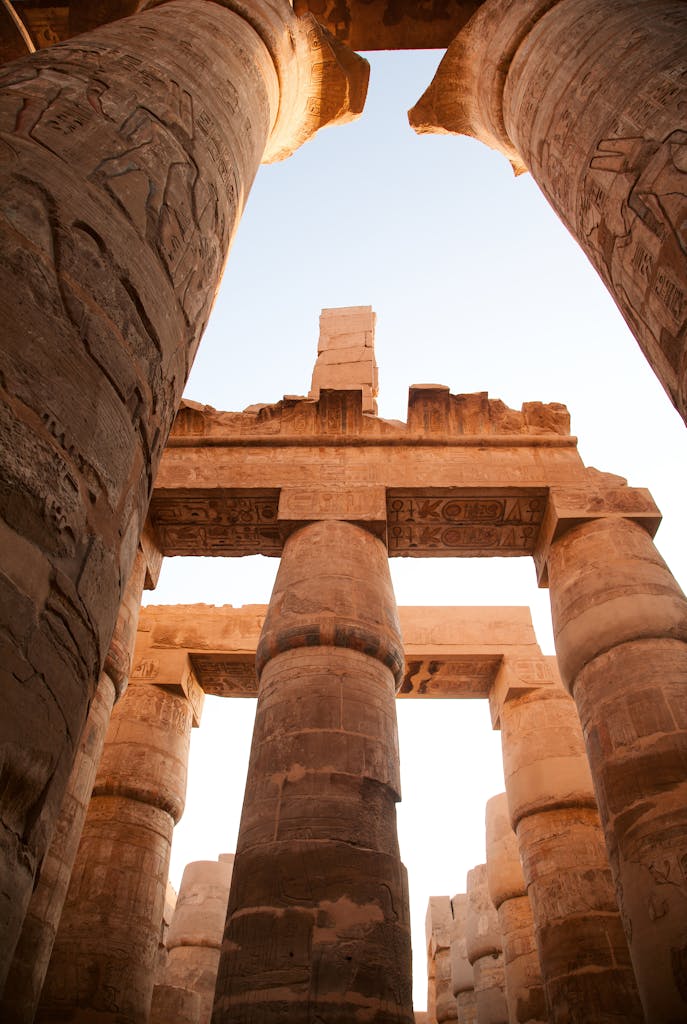 Majestic columns of Luxor Temple showcasing ancient Egyptian architecture under a clear sky.
