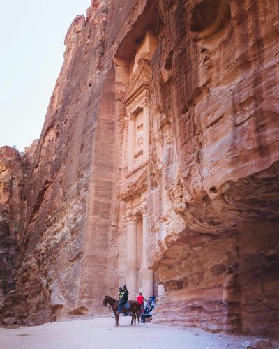 Explore Petra's iconic Al-Khazneh, a stunning ancient treasuries carved into sandstone cliffs.